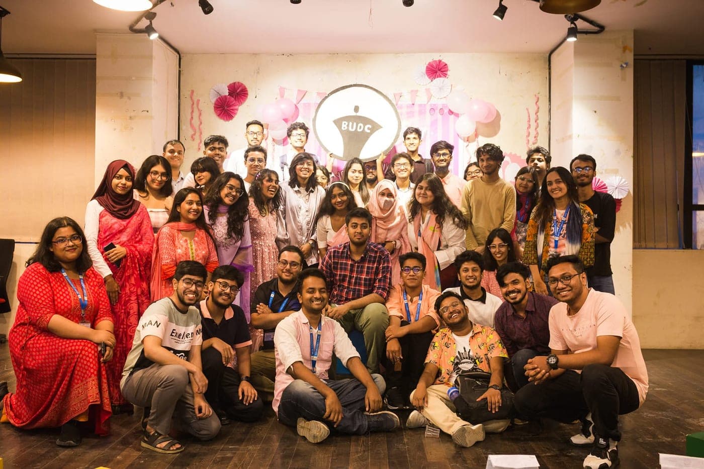 The debating club together under its logo at the end of an event.
